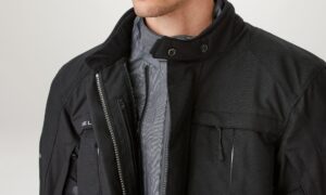 A man wearing a Belstaff Highway Jacket with zippered pockets.
