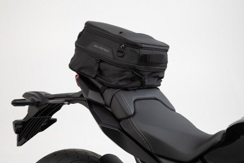 A black motorcycle with a SW- Motech ION- S Tail Bag on the back seat.