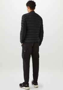The back view of a man wearing a Belstaff Long Way Up- Down Jacket.